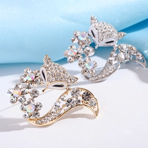 Sparkling fox brooch pins with clear crystals and white enamel in gold and silver finish