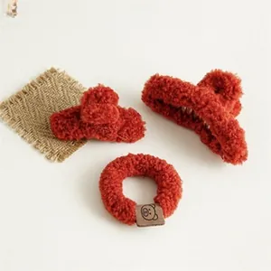 Three-piece red plush hair accessory set with claw clips and teddy bear velvet scrunchie