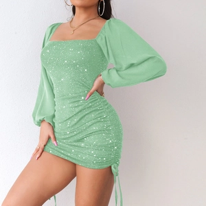 Detail showing light green sequined fabric with pleated texture on square neck dress