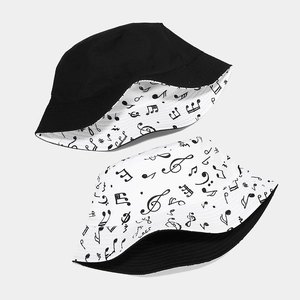 Double-sided bucket hat with musical note print in black and white cotton canvas