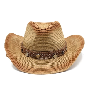 Detail of woven straw cowboy hat featuring colorful ethnic band and bronze coin charms