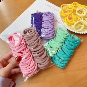 Pack of 50 seamless high elasticity hair ties in diverse candy colors and soft textures