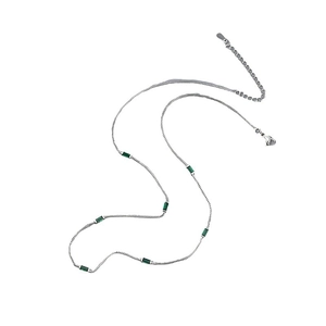 Minimalist silver chain necklace with rectangular emerald green zircons on white background