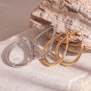 Minimalist teardrop metal hoop earrings in polished gold and silver finish with leverback