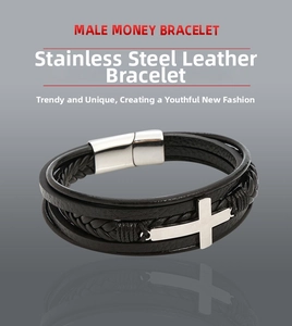 Detail of multi-layer black braided leather bracelet with stainless steel cross charm