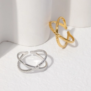 Detailed view of adjustable crossover X rings in gold and silver finish on white stands