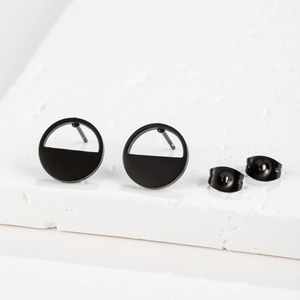 Detailed macro view of matte black geometric earrings with solid semi-circle design