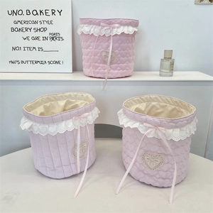 Pink quilted fabric storage basket set with white lace trim and cute ribbon bows