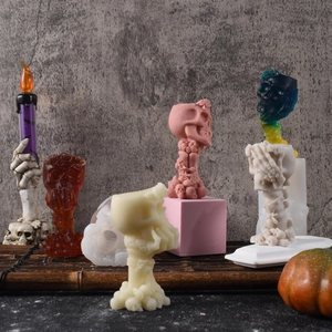 Detailed view of Halloween skull candle molds in various colors and gothic shapes