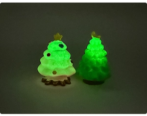 Glow-in-the-dark mini Christmas tree landscape figurines with luminous green effect