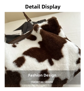 Close-up of fluffy faux fur tote bag with brown cow print pattern and leather handles