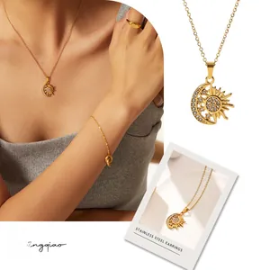Detail of 18K gold plated stainless steel sun and moon pendant necklace set with zircon
