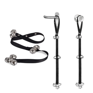 Adjustable black nylon dog training doorbell strap with seven loud silver metal bells