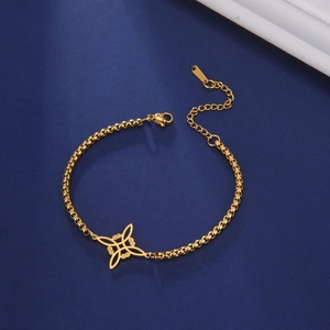 Gold stainless steel box chain bracelet featuring a Celtic knot pendant on blue background