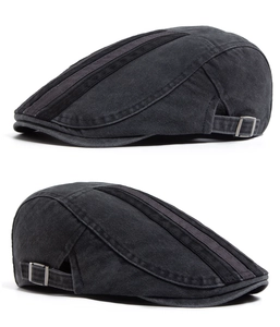 Detail of washed cotton ivy cap featuring side metal buckle and striped stitching