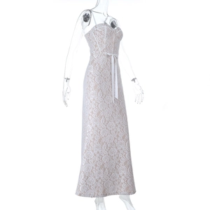 Detail of white floral lace embroidery on dress with sweetheart neckline and silk ribbon