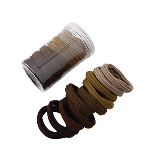 Seamless high-elastic hair ties in earth-toned colors packed in a transparent jar