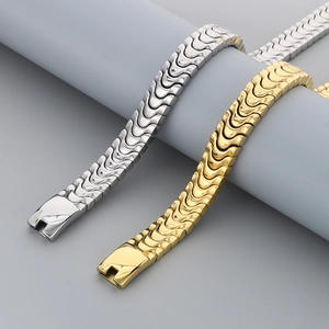 Detailed view of dragon bone link bracelets in gold and silver stainless steel finish