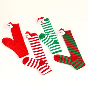 Festive Christmas stripe over-knee socks featuring 3D Santa Claus plush ornaments set