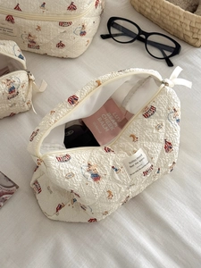 Detailed interior view of quilted cotton circus print makeup bag showing large capacity