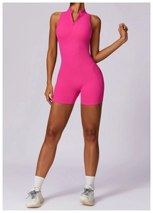 Detailed view of high-stretch hot pink yoga jumpsuit with half-zipper front and slim fit