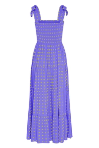 Detail showing the purple smocked bodice and adjustable bow straps on the maxi dress