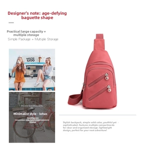 Detail view of pink nylon crossbody bag showing multiple zipper pockets and adjustable strap