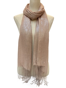 Detail of champagne gold shimmering scarf with fringe trim on a mannequin model