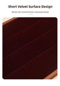 Macro view of walnut wood tray with soft dark red velvet slots for rings and jewelry