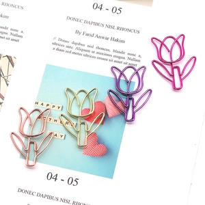 Tulip shaped metal paperclips in rose red, purple, and gold on a decorative card