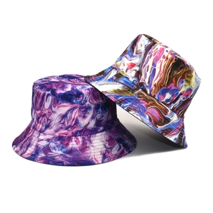 Detailed close-up showing artistic tie-dye patterns and fine stitching on summer bucket hats