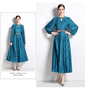 Detailed view of teal pleated maxi dress featuring shimmering silver sequin waist and collar