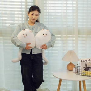 Cute white plush Persian cat pillow set with long tail, held by model in home setting