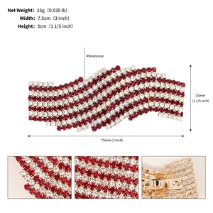 Macro detail of luxury rhinestone bow hair clip showing size 7.5cm and red crystals