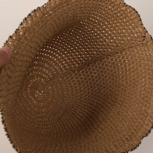 Brown woven breathable straw fisherman hat with hollow pattern and wavy brim for sun protection