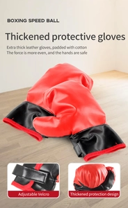 Detalle de guantes de boxeo de cuero rojo con correa de velcro ajustable y protección
