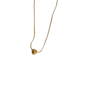 Polished gold titanium steel necklace with a 3D heart pendant on a sleek snake chain