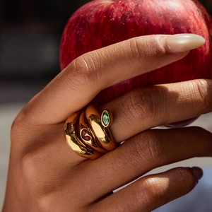 18K gold plated stainless steel ring with red and green gemstones in twisted design