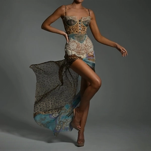 Detail view of leopard print and lace patchwork dress with high slit and corset top