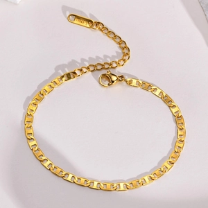 Close-up of gold pig nose chain with polished lobster clasp and steel engraving