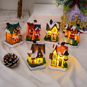 Set of 6 glowing resin Christmas village houses with warm LED lights and vintage details