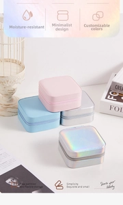 Detailed view of portable square jewelry boxes in four colors with secure zipper closures
