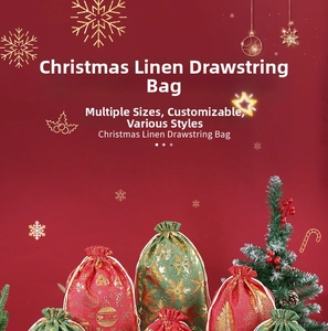 Detailed view of red and green burlap Christmas bags with gold snowflakes and drawstring