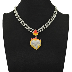 Hip hop cuban chain with luminous flame heart pendant featuring red and yellow enamel details