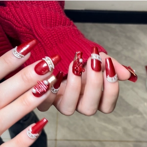 Deep ruby red coffin press-on nails with silver glitter tassels and pearl accents