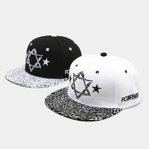 Hip hop baseball caps with star embroidery and elephant print brims in black and white