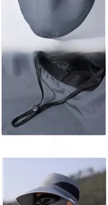 Detail of adjustable windproof drawstring and breathable mesh on dark grey sun hat