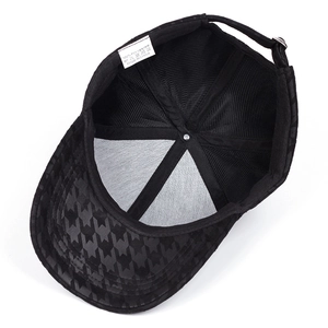 Detail view of plaid baseball cap interior with breathable mesh lining and care label