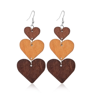 Retro hollow wooden heart drop earrings featuring triple-tier brown layered geometric design