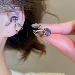 Detailed view of a purple round-cut zircon double-layer ear cuff on a silver metal mount
